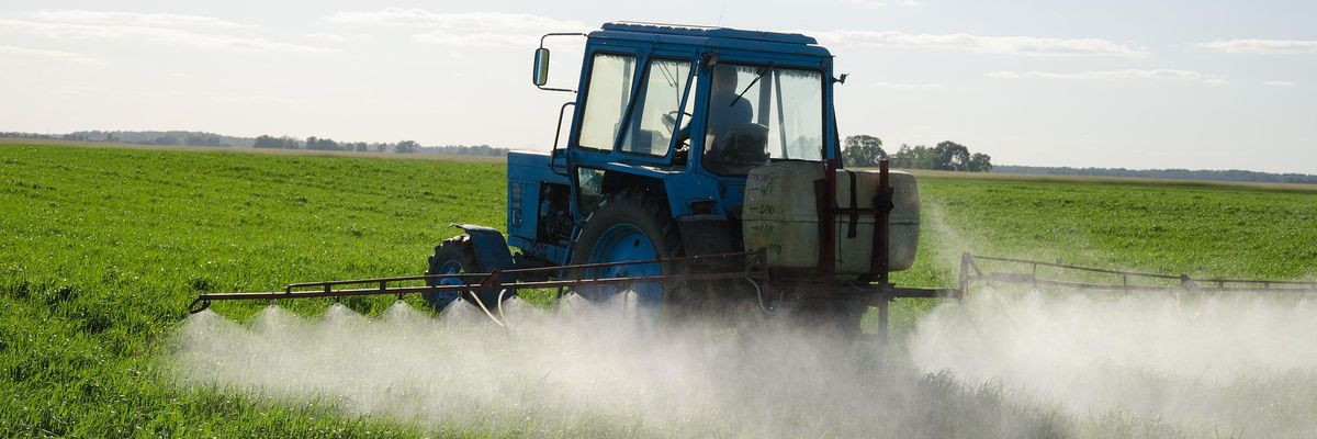 tractor pesticide field