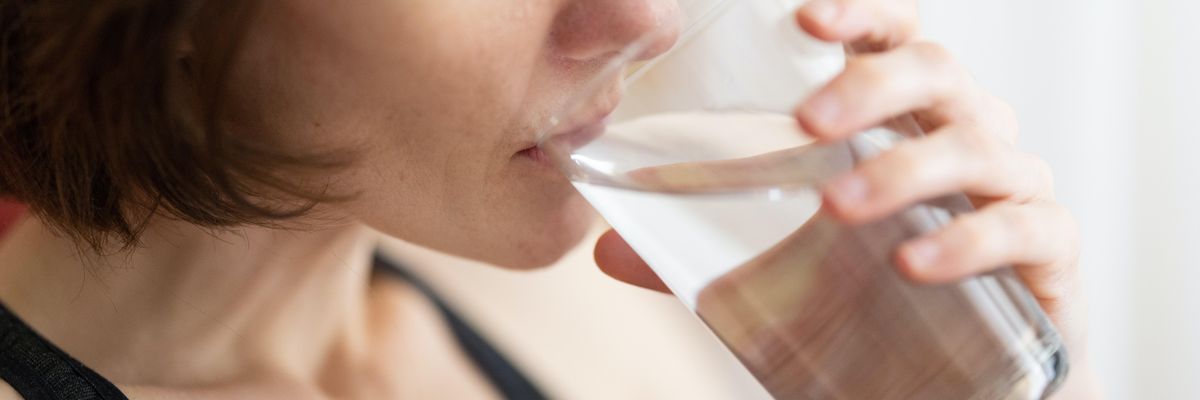 woman drinking glass of water