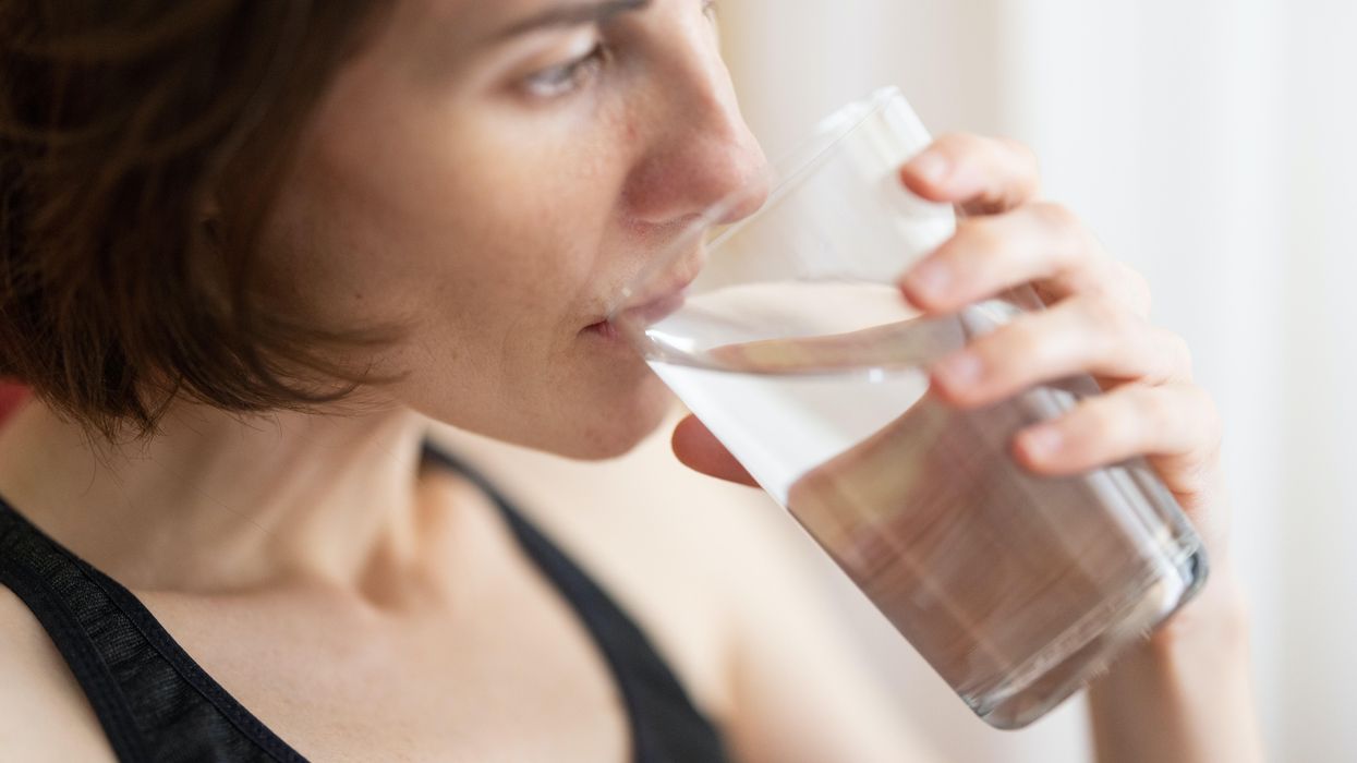 woman drinking glass of water